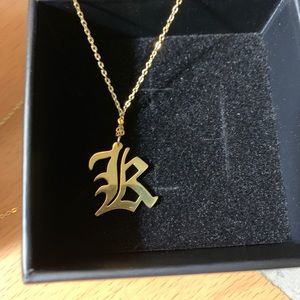 Gold pleated old English “K” pendant necklace